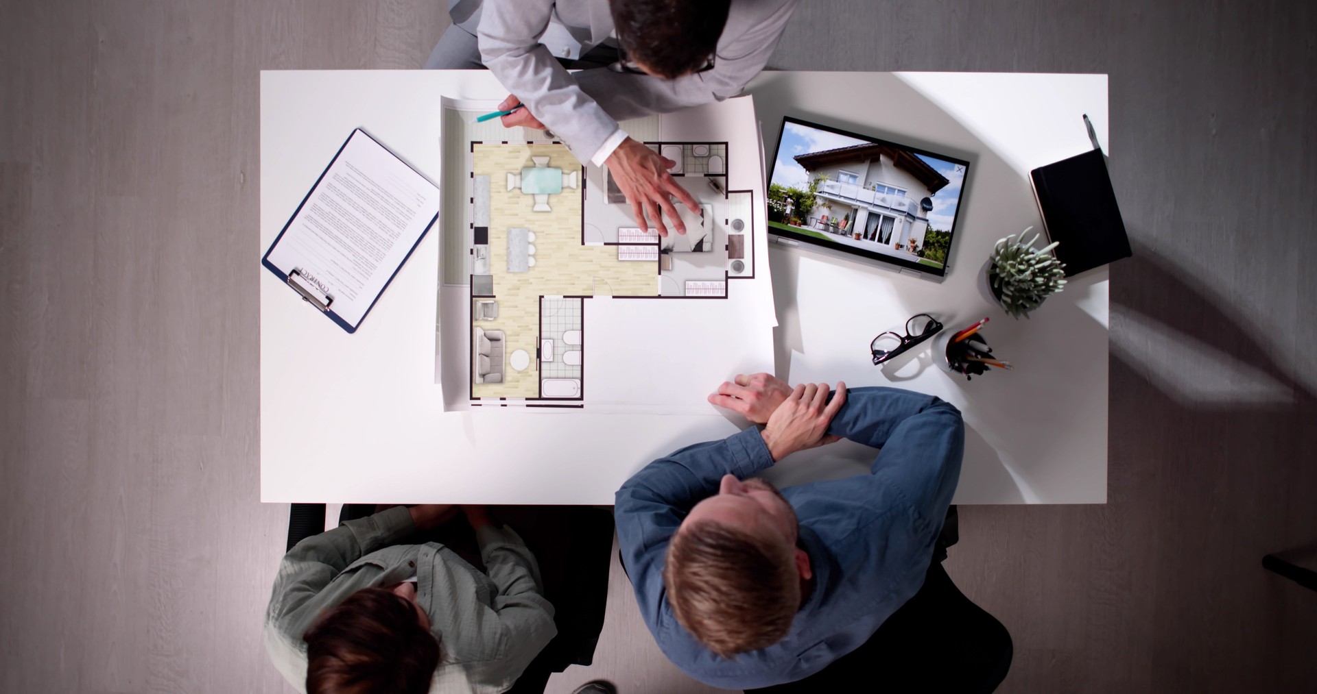 Real Estate Consultant Showing Apartment Blueprint